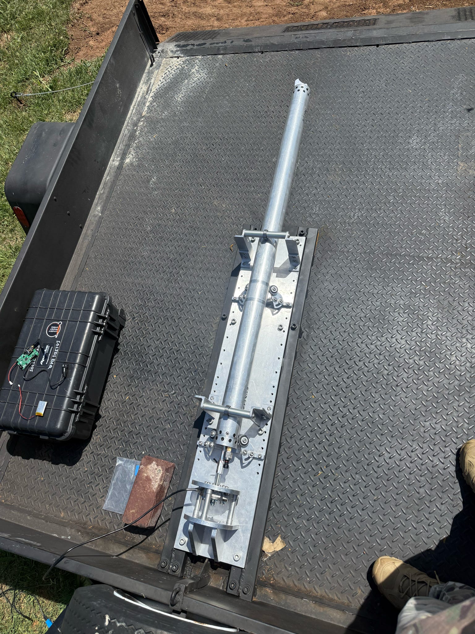 Motor mounted on an outdoor test stand.
