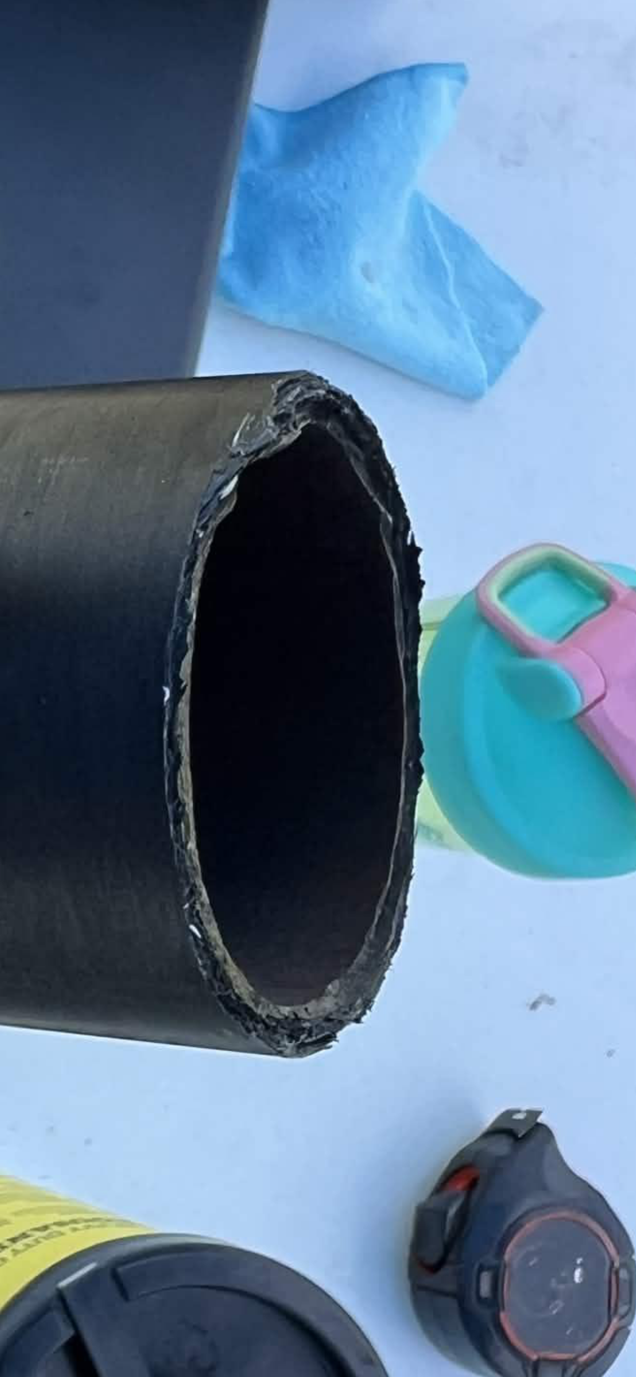 Damaged edge of a composite rocket case.