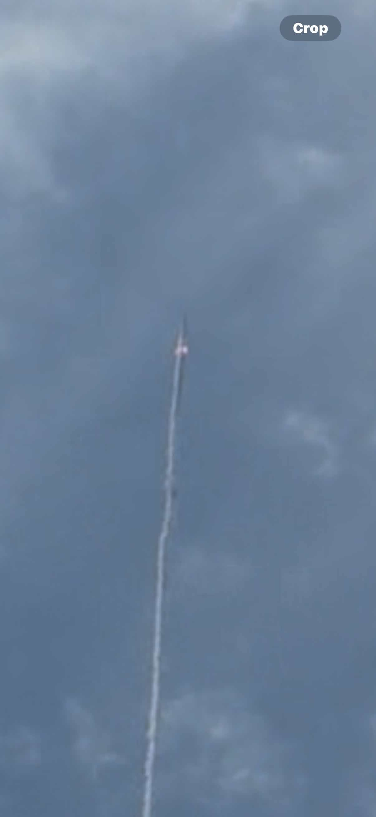 Invictus in flight with a visible trail against the sky.
