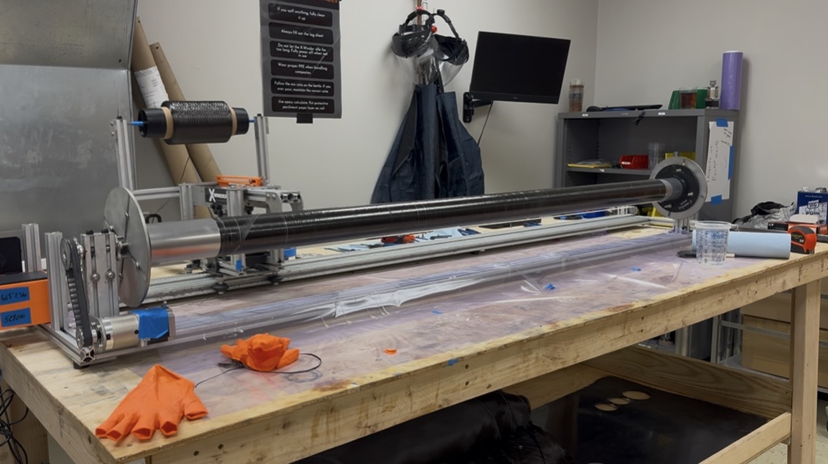 Composite body tube on the filament winding machine.